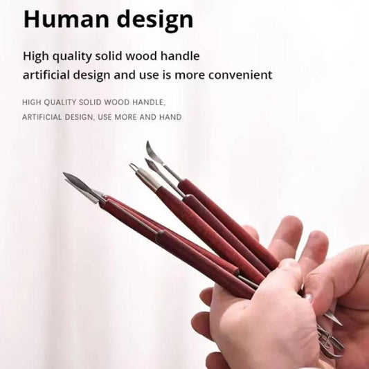 Clay sculpting tools with rosewood handles fanned in hand, stainless steel tips
