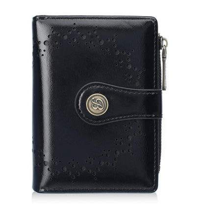 Women’s short wallet in black oil-waxed leather with perforated pattern and zipper