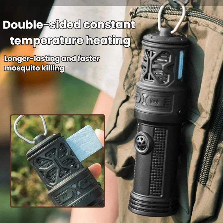 Portable mosquito repellent heater clipped to outdoor backpack strap, dark vented lantern design