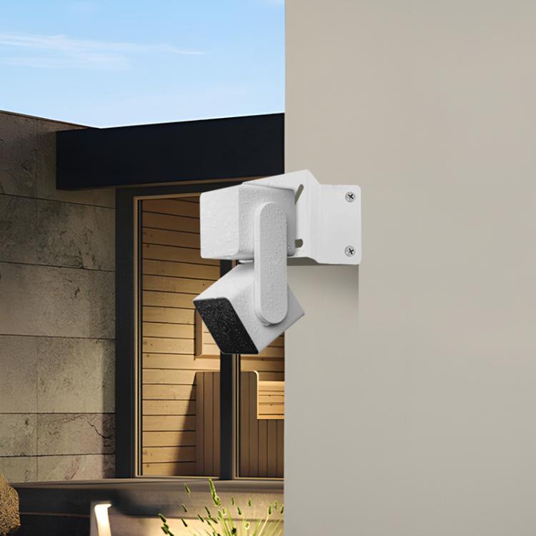 Installed white corner security camera mount with bracket arm and plate