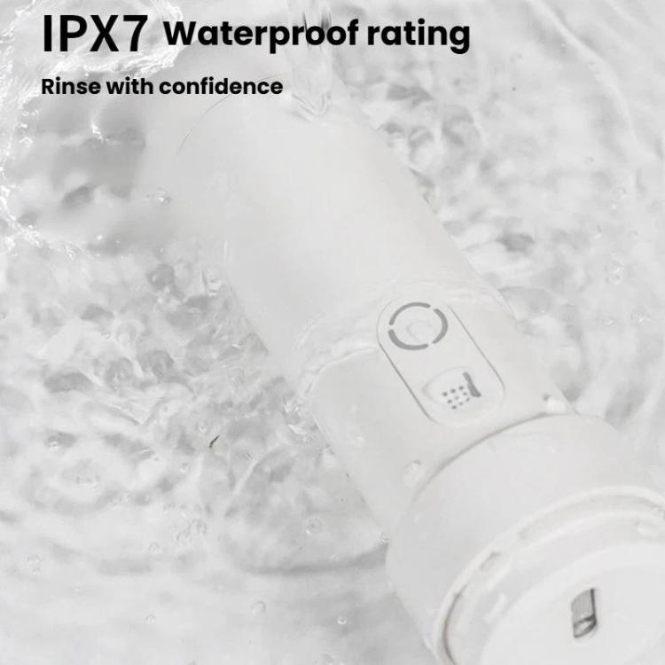 Waterproof bidet sprayer handle with buttons, shown in water with bubbles, white