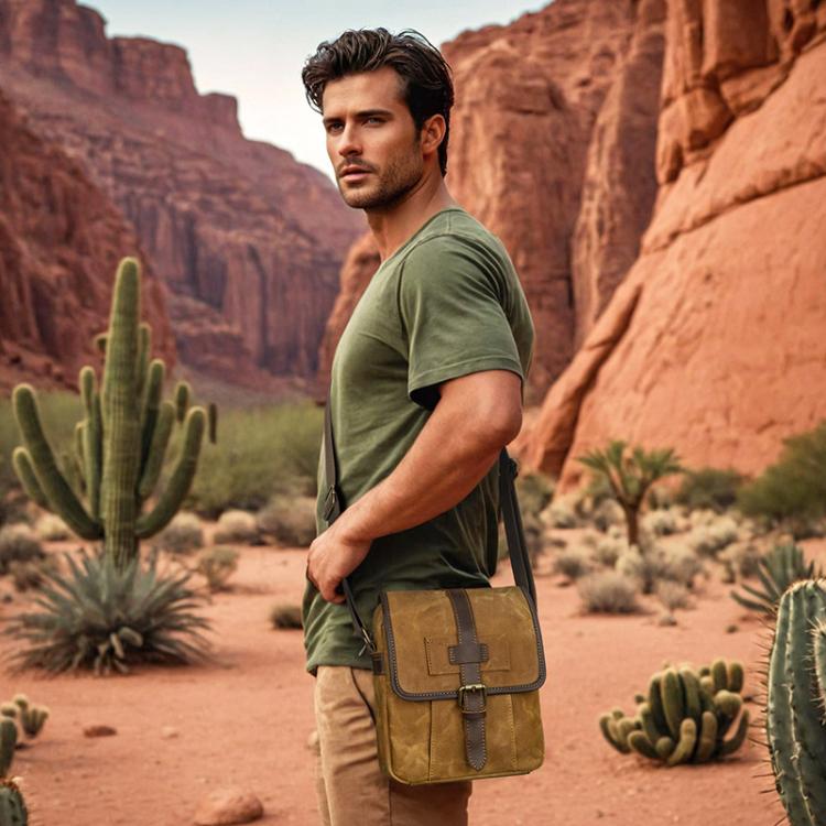 Dusty yellow waxed canvas crossbody messenger bag worn on model with leather buckle