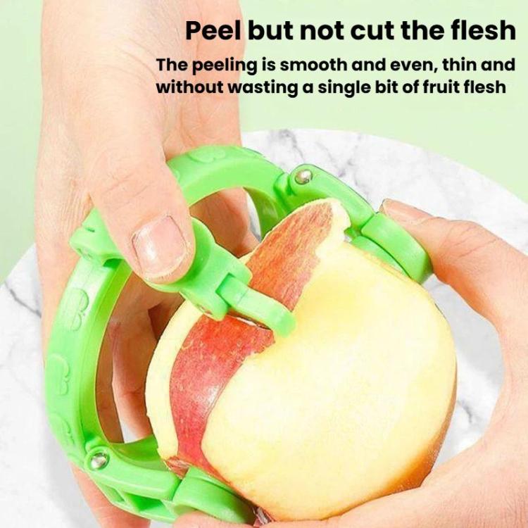 Green hand-crank peeler removing peel from a red apple, showing pale slices
