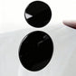Two black circular fuel tank cap stickers on car fuel area, side-by-side