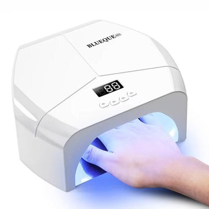 White LED nail gel curing lamp with digital display; hand inside curing chamber