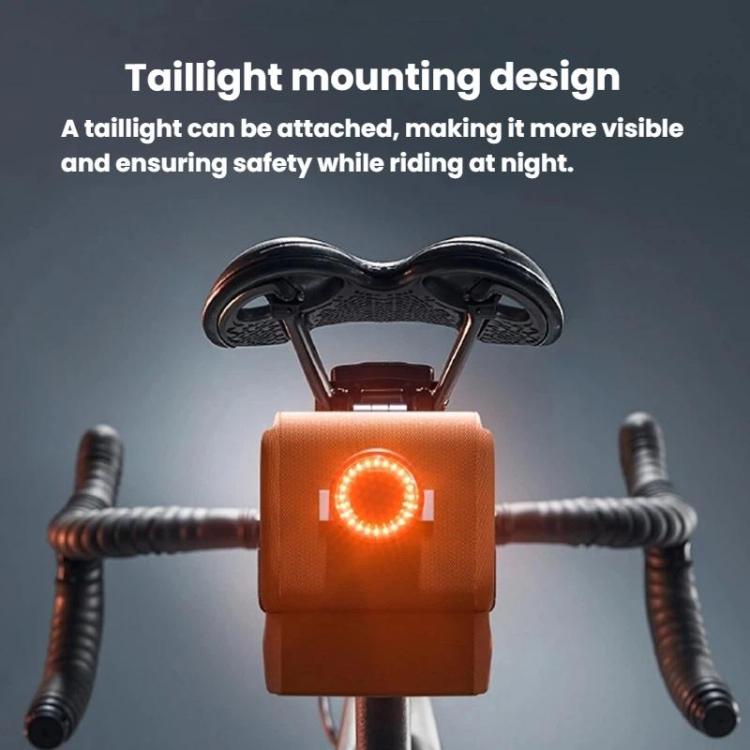 Orange bike seat bag with rear light mounting and visible red reflector