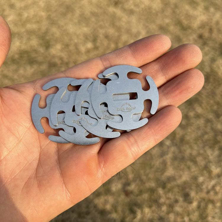 Stainless steel rope clip shown in hand, round latch fastener