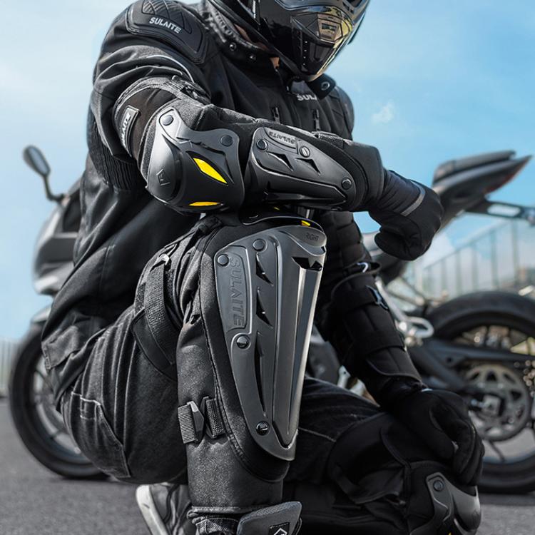 Black motorcycle protective gear pads with molded armor, shown on rider arms and knees