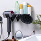 Wall-mounted hair dryer holder with diffuser head and nozzle attachments resting in slots.