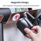Magnetic-style wall mount hair dryer holder with two cradles and hand placing a nozzle.