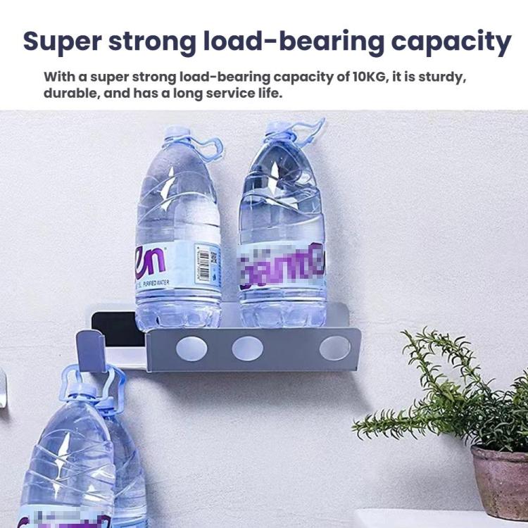 Gray wall mount hair dryer nozzle holder with two slot openings, holding items.