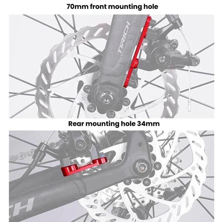 Red road disc brake adapter mounted on a bicycle disc brake caliper area.