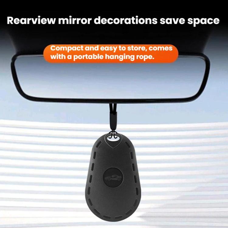 Black oval wiper repair tool hanging from the rearview mirror