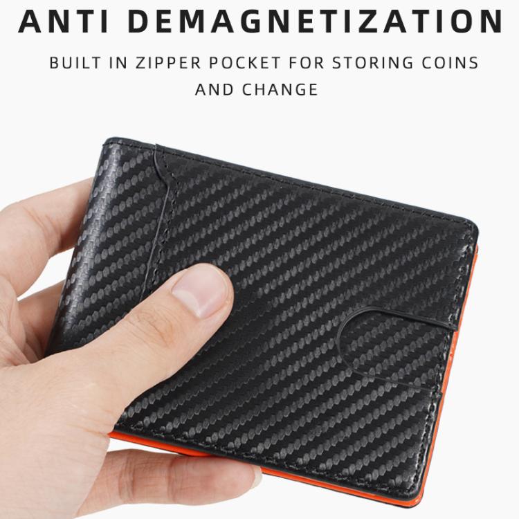 Men's carbon fiber ID card holder held in hand, slim profile with orange interior trim