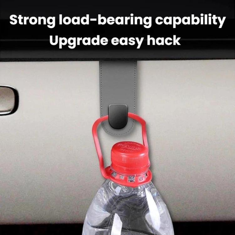 Car interior hook storage organizer, red and black holder securing a bottle
