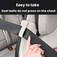 Car seat belt shoulder pad positioner in light beige/cream, padded strap cover on seat belt