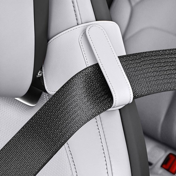 Car seat belt shoulder pad positioner in light beige/cream, padded cover on seat belt