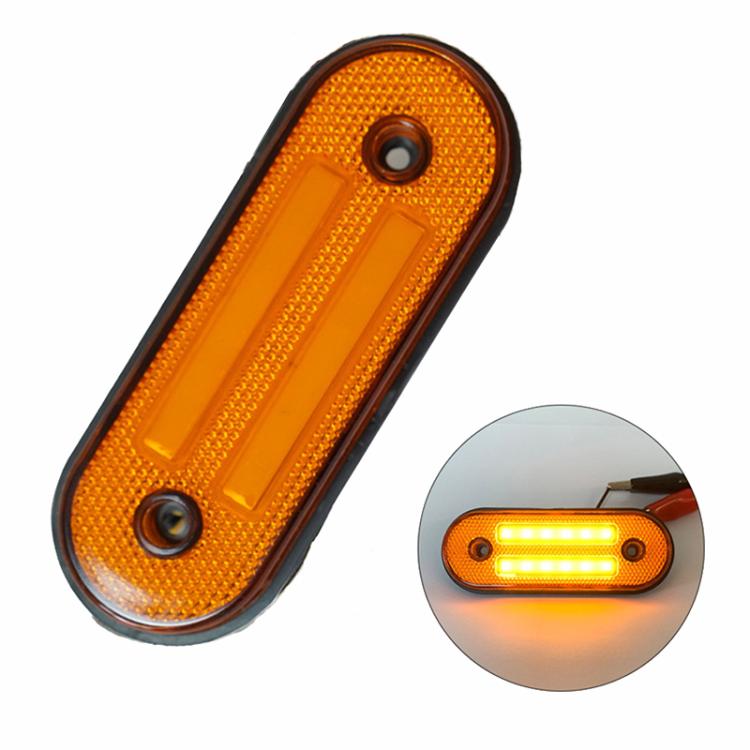 Amber oval LED side marker lamp with black border, mounting holes, and two LEDs