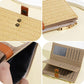 Beige straw-weave wallet close-up with side zipper and interior card compartments