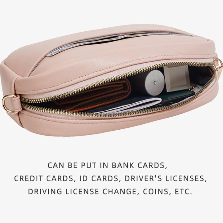 Pink zippered crossbody pouch underside view with interior card slot pockets.