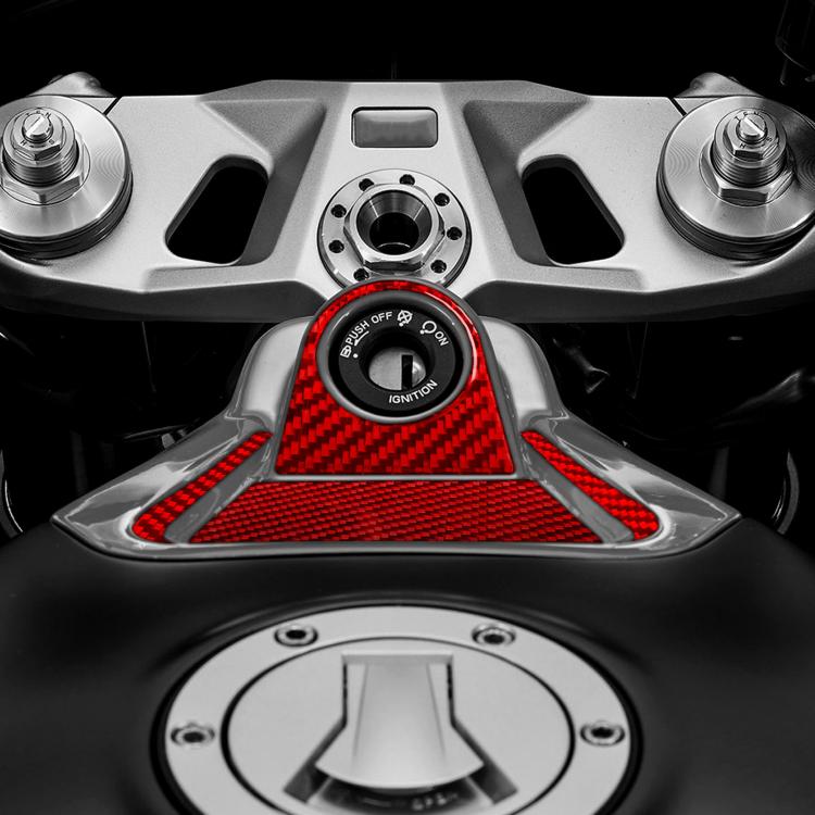 Red carbon-fiber ignition zone decal surround on dashboard near the ignition switch