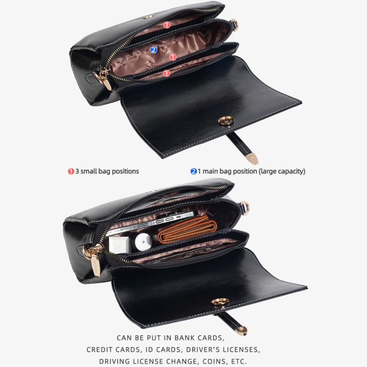 Black waxed leather crossbody bag opened with compartments and zippered interior pocket
