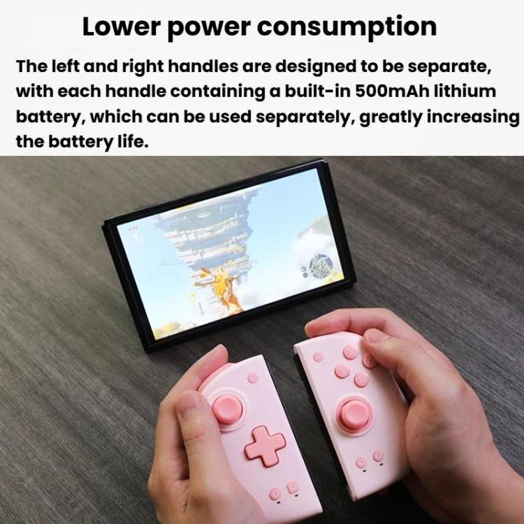 Pink split game controller held in hands with separate left and right halves