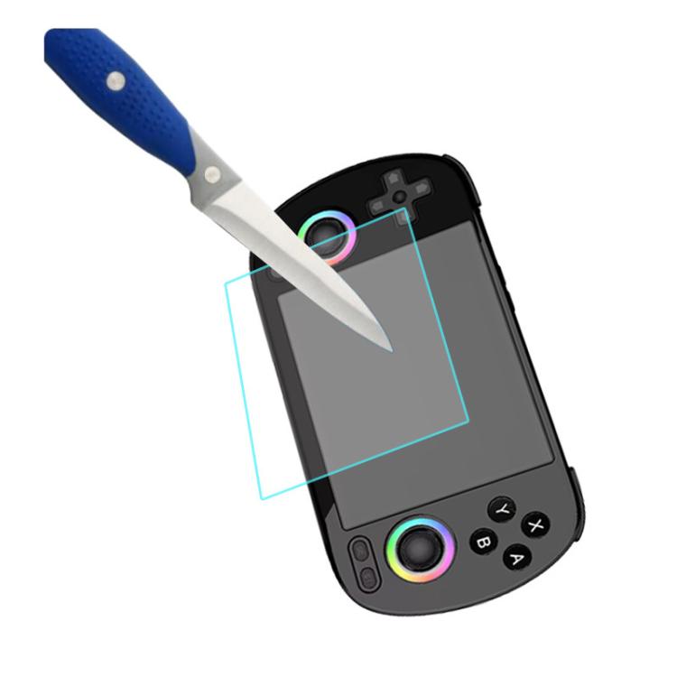 Tempered glass screen protector being applied to handheld console display with squeegee