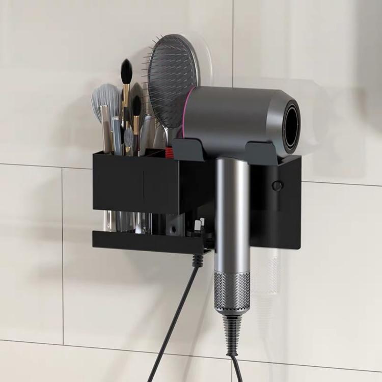 Black wall-mount hair dryer holder with brush compartments and cord organizer.