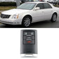 Black remote key fob with 3+1 buttons and metal key blade, silver bottom