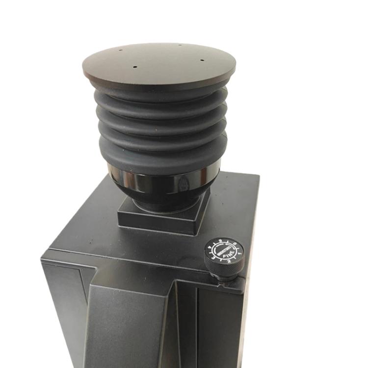 White ribbed bean hopper air blower attachment mounted on a grinder body with black outlet
