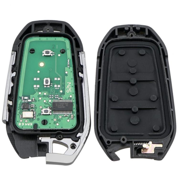 Key remote casing opened to show green circuit board and black button pad