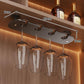 Under-cabinet stemware rack with hanging clear wine glasses and size markings