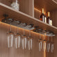 Under-cabinet wine glass holder rack with clear hanging glasses and black metal base