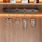 Under-cabinet champagne and wine glass holder with hanging clear glasses on metal bar
