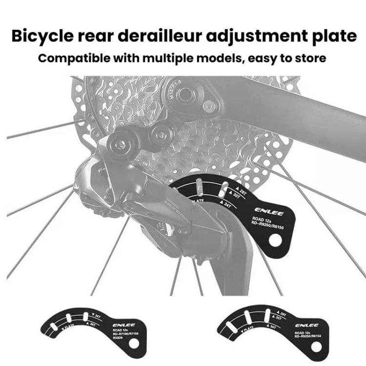 Black bike rear derailleur adjustment plate with guide markings, shown in use
