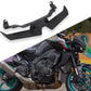 Black bird beak lower headlight fairing spoiler mounted on motorcycle front.