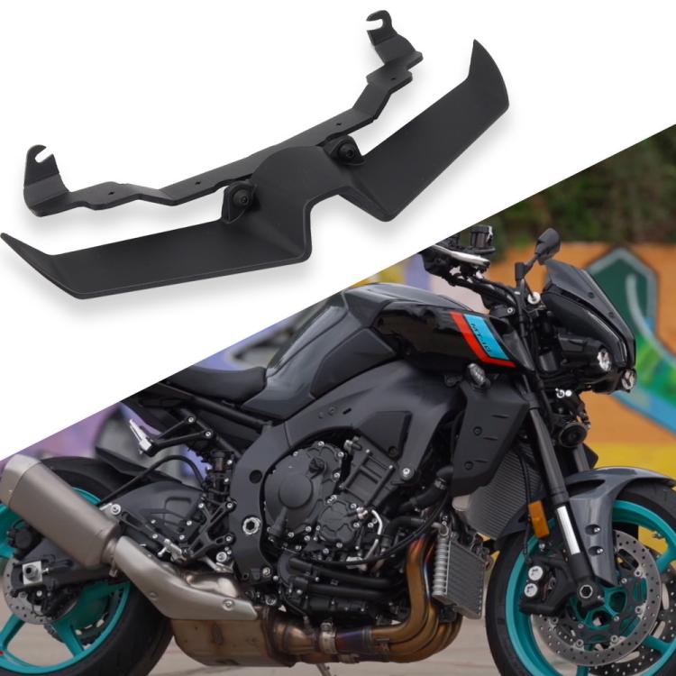 Black bird beak lower headlight fairing spoiler mounted on motorcycle front.