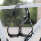 Double-headed steel cable lock with password dials looped through a bike frame