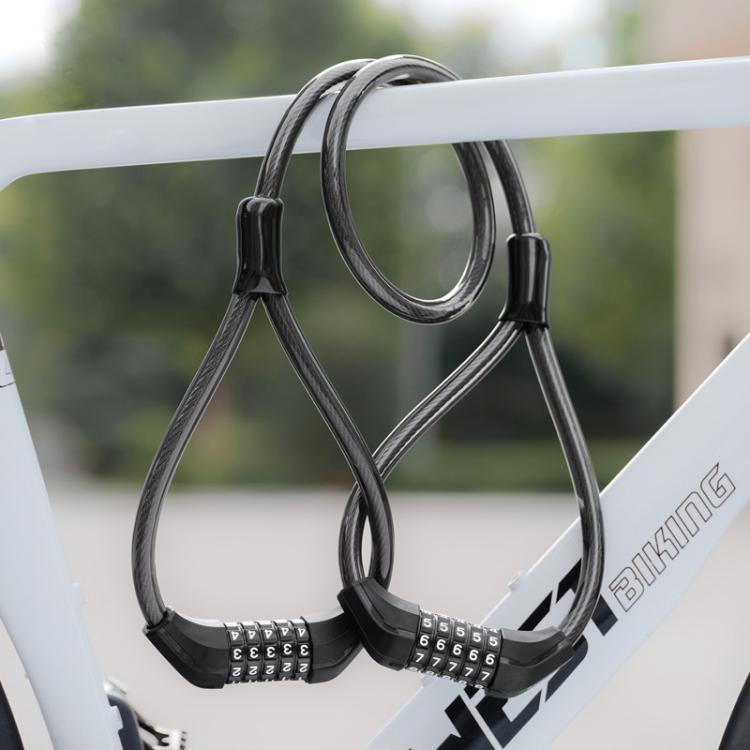 Double-headed steel cable lock with password dials looped through a bike frame