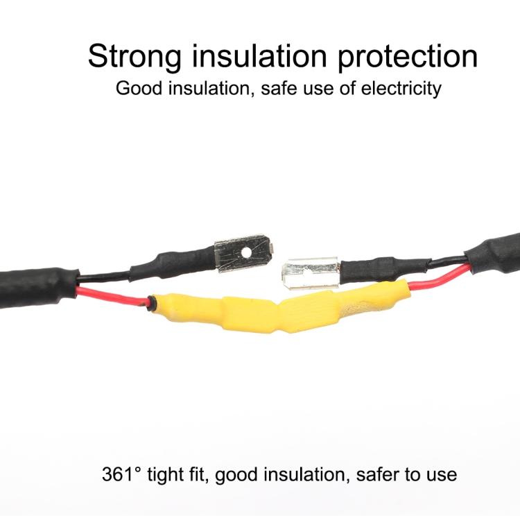 Heat shrink tubes insulating a wire splice, blue and yellow tubes over black cable