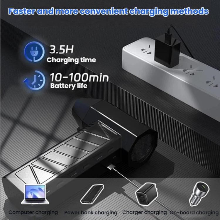 Cordless vacuum blower resting on a charging base with USB cable