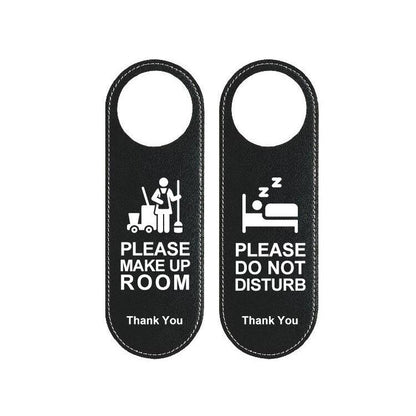 Reversible black leather hotel door hanger sign, “Please Make Up Room” and “Do Not Disturb”.