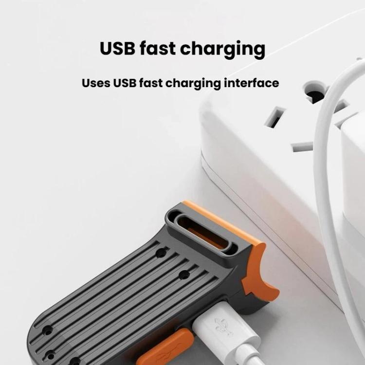 USB charging bicycle tail light with orange accents and black shark-shaped body