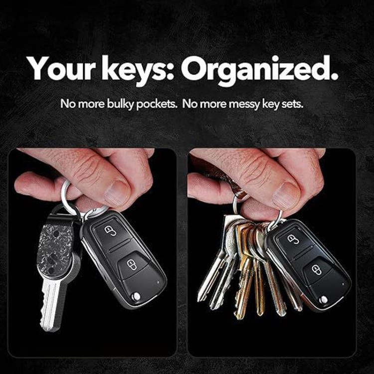 Hand holding a compact key holder with a set of keys attached