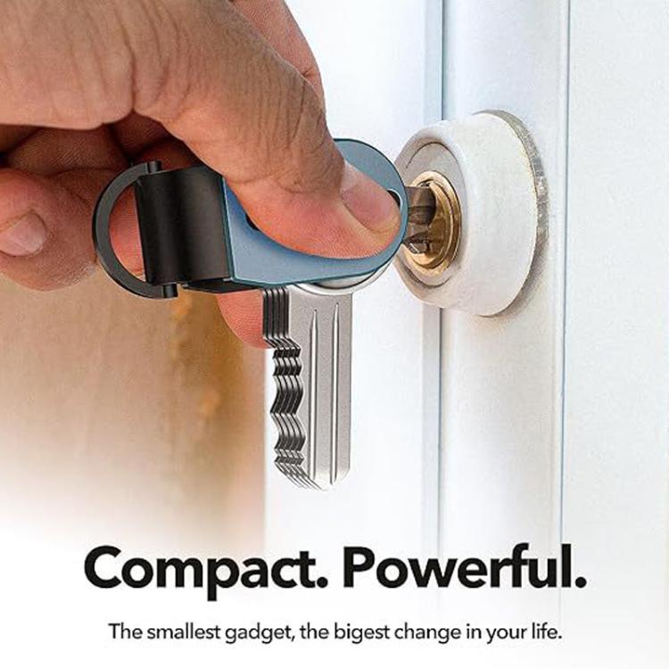 Compact dark mini key holder clipped to a door with a key ring and keys