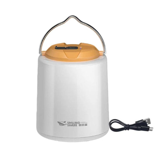 Portable camping lantern light with white body and amber top handle, includes charging cable