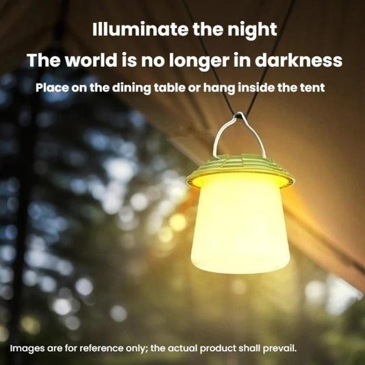 Hanging camping lantern glowing warm yellow light with arched handle