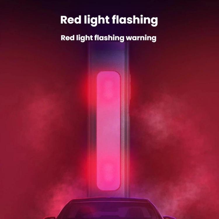 Green flashlight with red flashing warning light strip