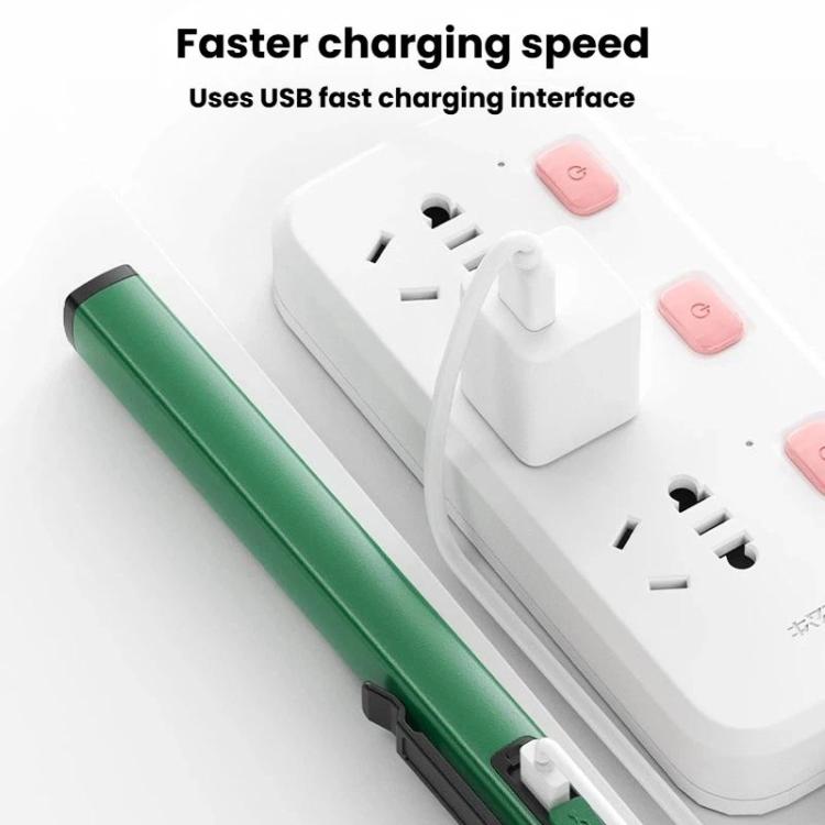 Green flashlight charging on a white USB charger base